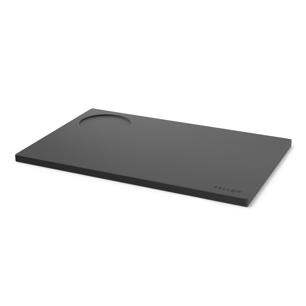 Fellow Espresso Tamping Mat: rectangular black silicone with a circular indent and logo.