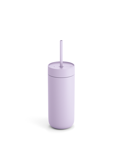 The Fellow Carter Cold Tumbler in light purple comes with a lid and straw on a white background.