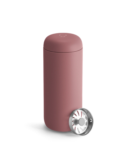 Fellow Carter Move Mug—matte pink with metal strainer, ideal travel mug on white background.