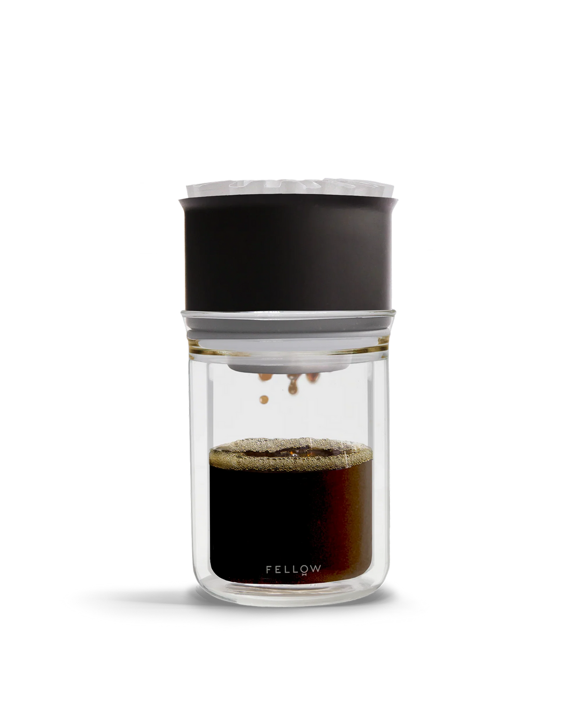 The Fellow Stagg [X] Pour-Over Set brews coffee into a glass carafe for optimal extraction.