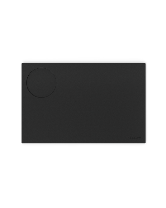 Fellow Espresso Tamping Mat: rectangular silicone mat with circular indentation for espresso.