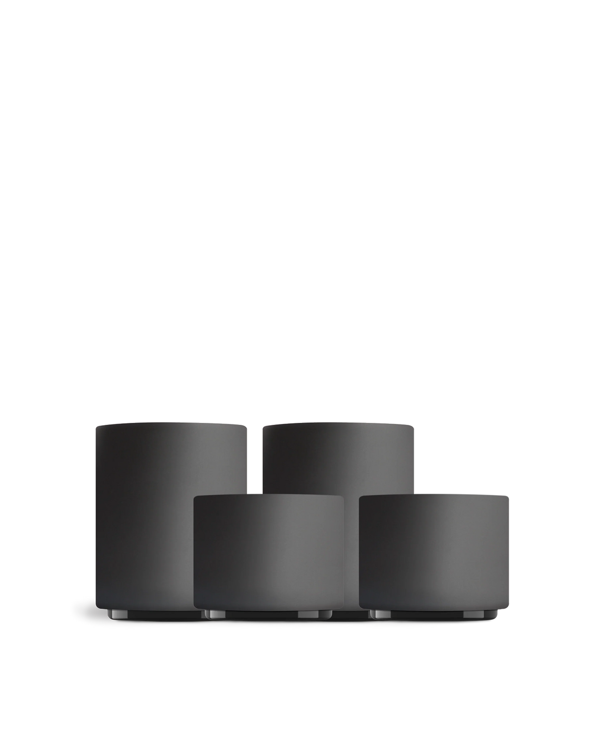 Four matte black Fellow Latte Art Set cups in different sizes on a white background.